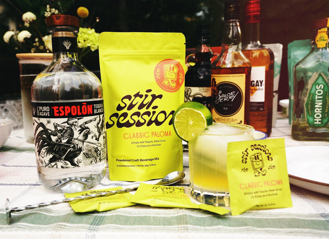 Stir Sessions Classic Paloma on table with drink and tequila next to packet.