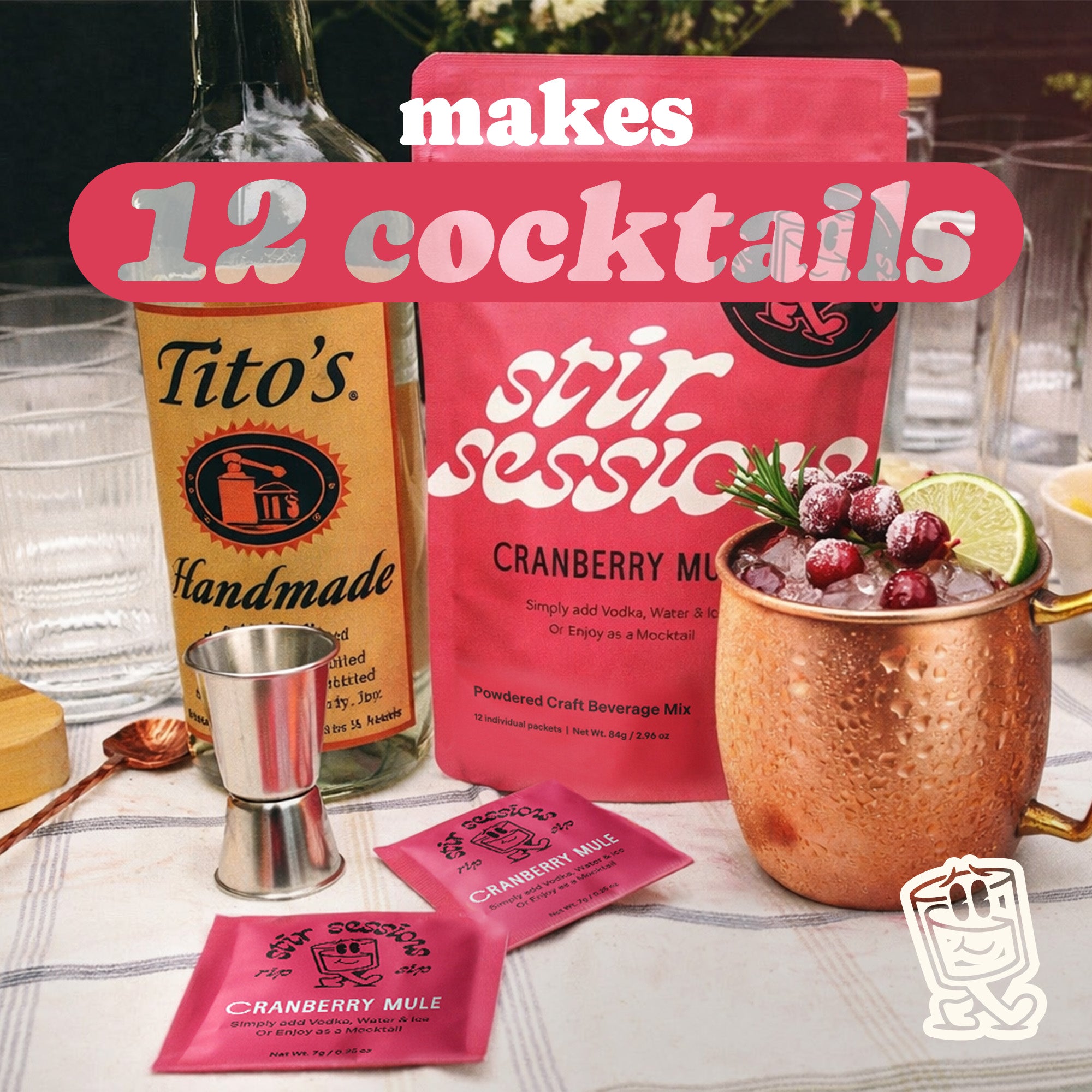Stir Sessions Cranberry Mule powdered cocktail or mocktail drink making kit with Tito's Handmade Vodka and mix packets on a table.