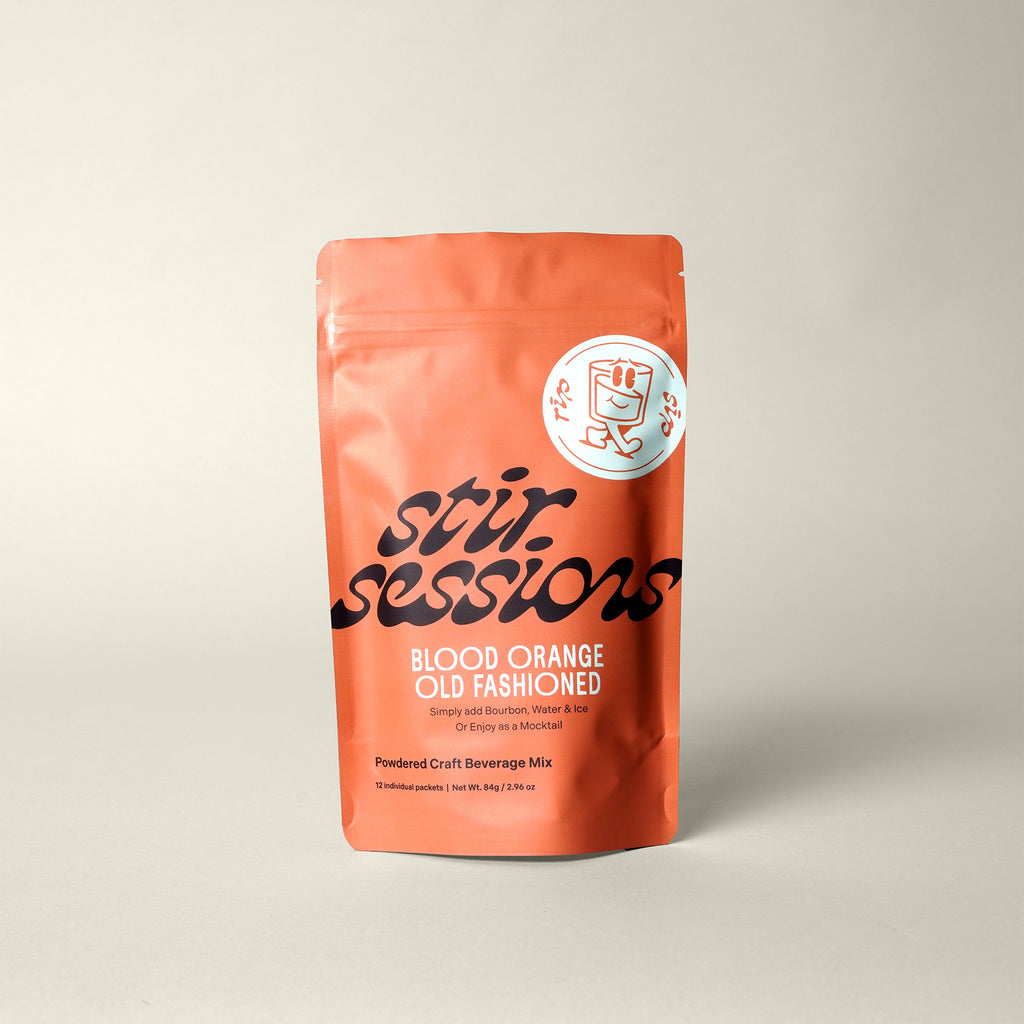 Stir Sessions Blood Orange Old Fashioned powdered cocktail or mocktail drink beverage mix packaging on a light gray background, front view.