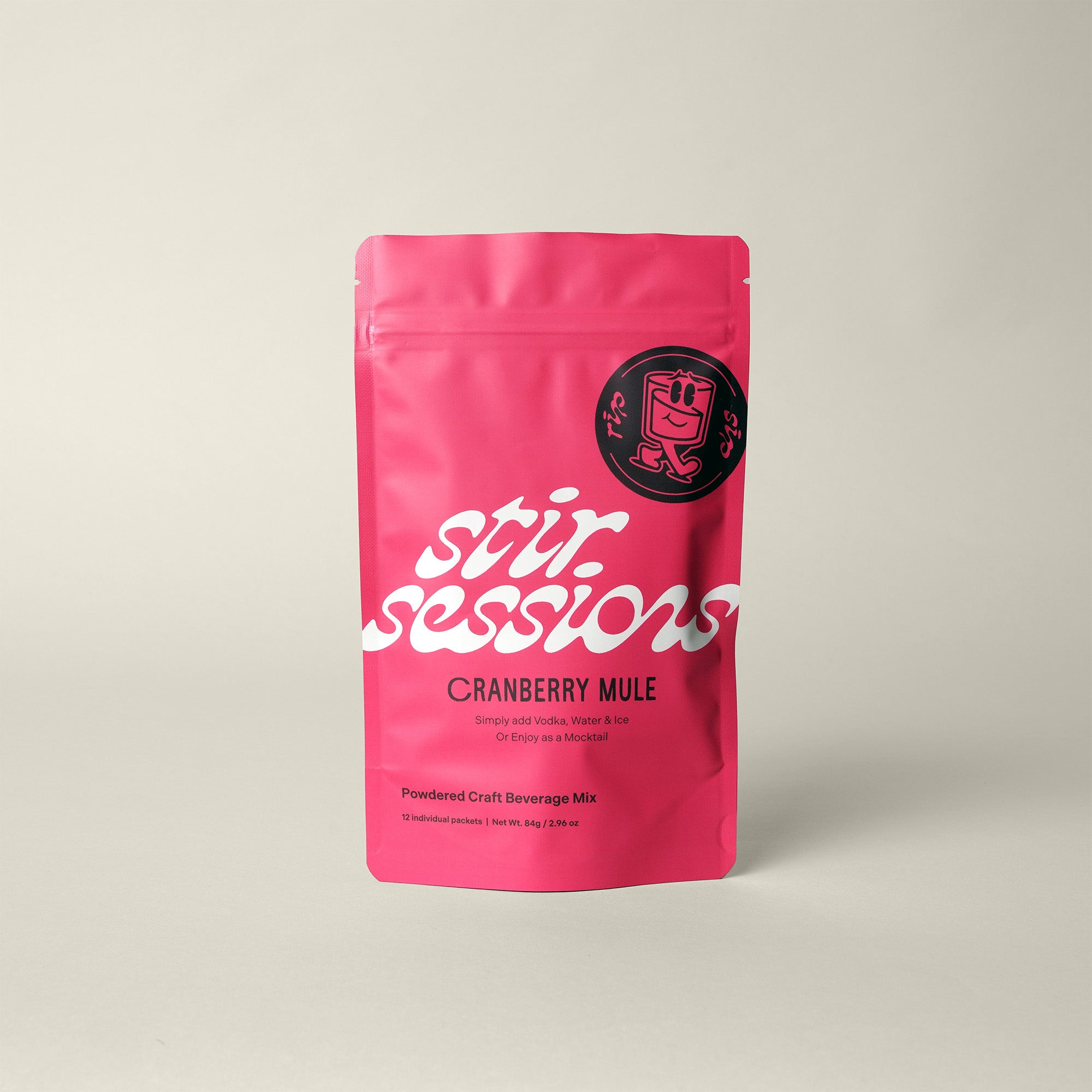 Stir Sessions Cranberry Mule powdered cocktail or mocktail drink beverage packaging on a beige background