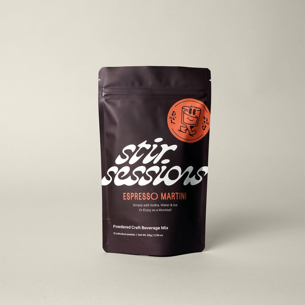 Stir Sessions Espresso Martini powdered cocktail or mocktail drink beverage packaging on a beige background, front view.