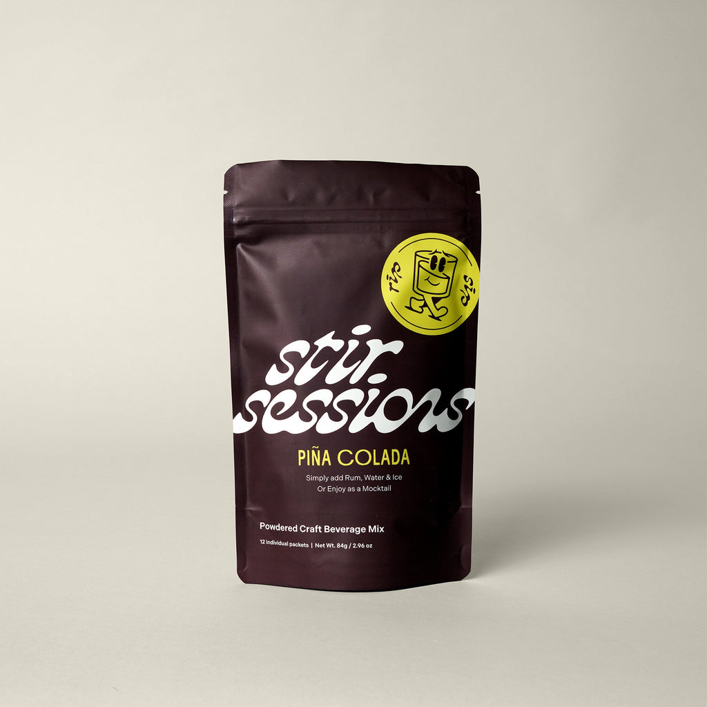Stir Sessions Mango Mai Tai powdered cocktail or mocktail drink beverage packaging drink mix on a beige background