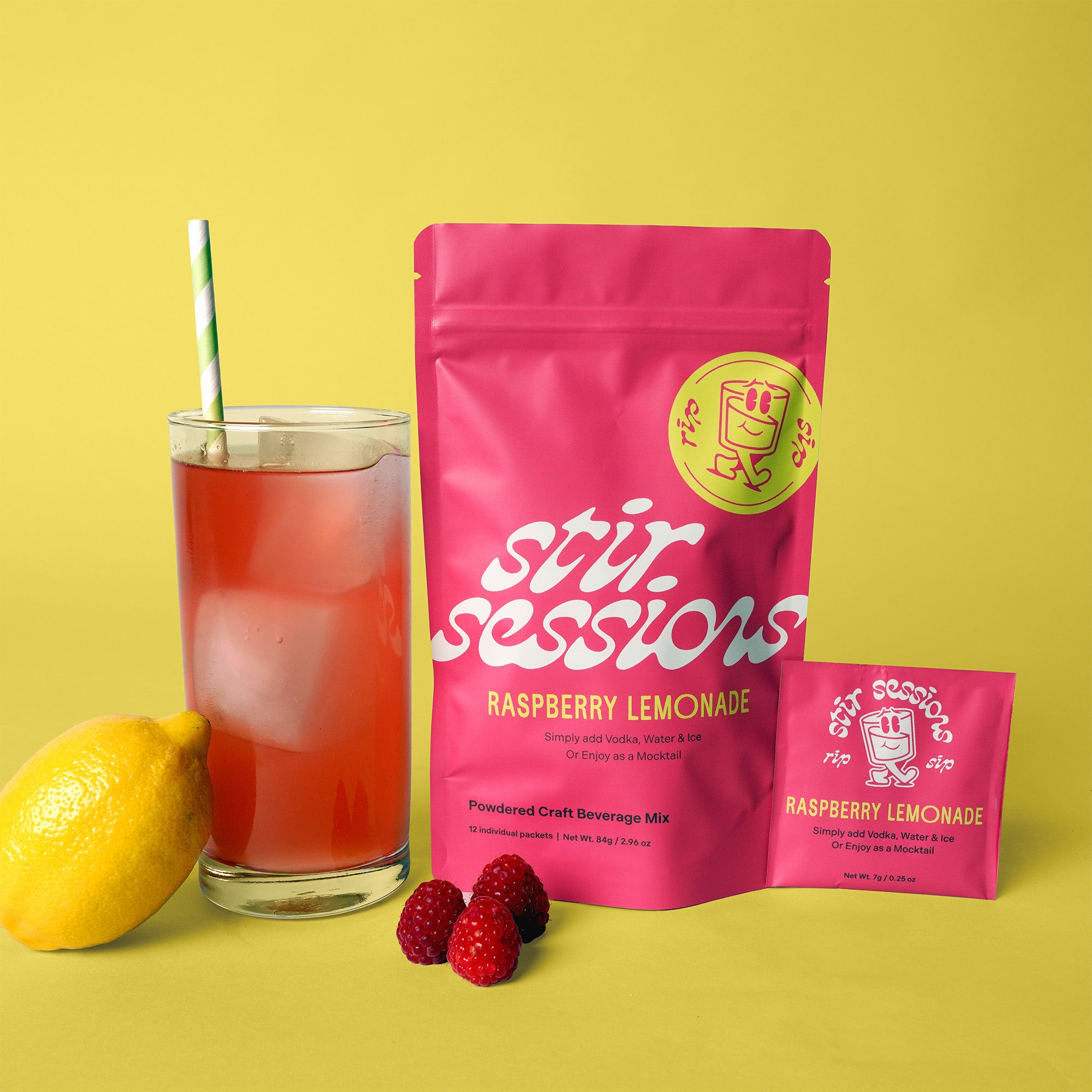 Stir Sessions Raspberry Lemonade powdered cocktail or mocktail drink beverage packaging with a glass of lemonade and lemon and raspberries on a yellow background.
