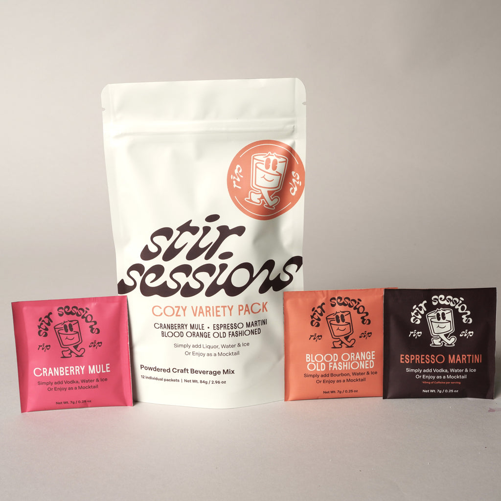 Stir Sessions Cozy Variety Pack of powdered craft cocktail or mocktail beverage mixers with individual packets on a light gray background