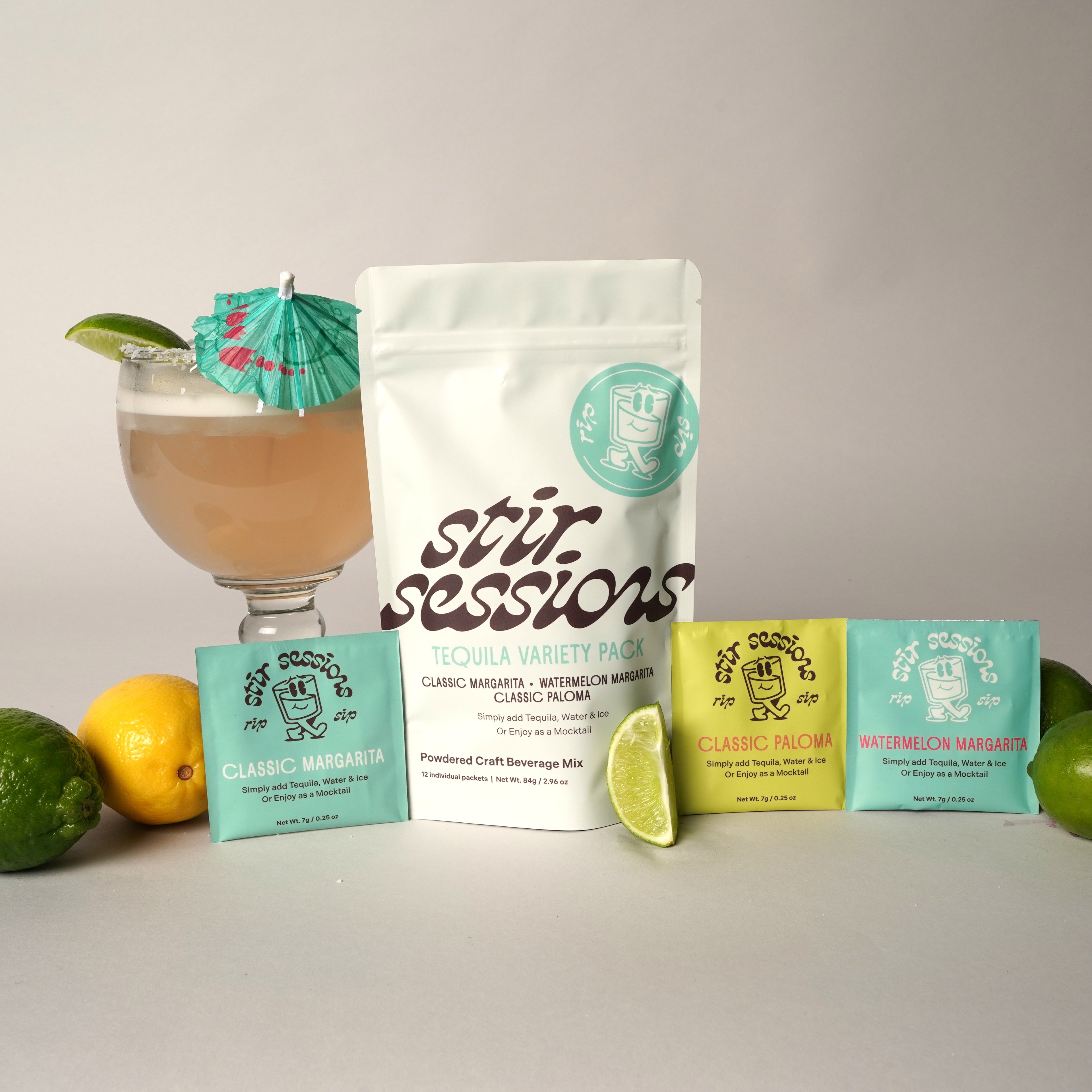 Stir Sessions Tequila Variety 12 pack of powdered cocktail and mocktail mixers. package with a cocktail and garnishes on a light background