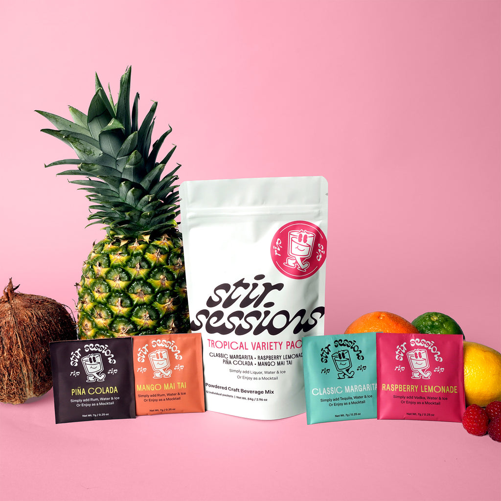 Stir Sessions beverage mix package with a pineapple, coconut, and various fruit on a pink background