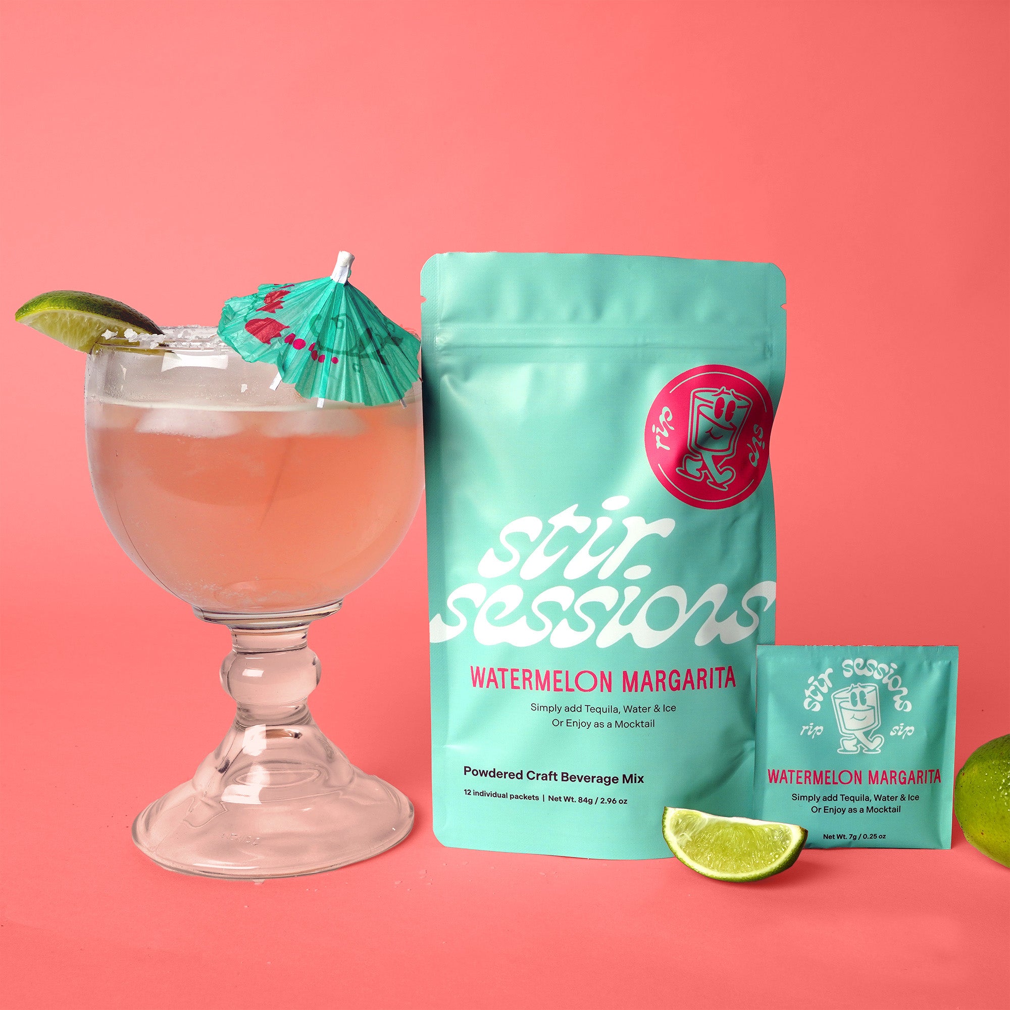 Stir Sessions Watermelon Margarita mix with a cocktail and lime wedges on a pink background